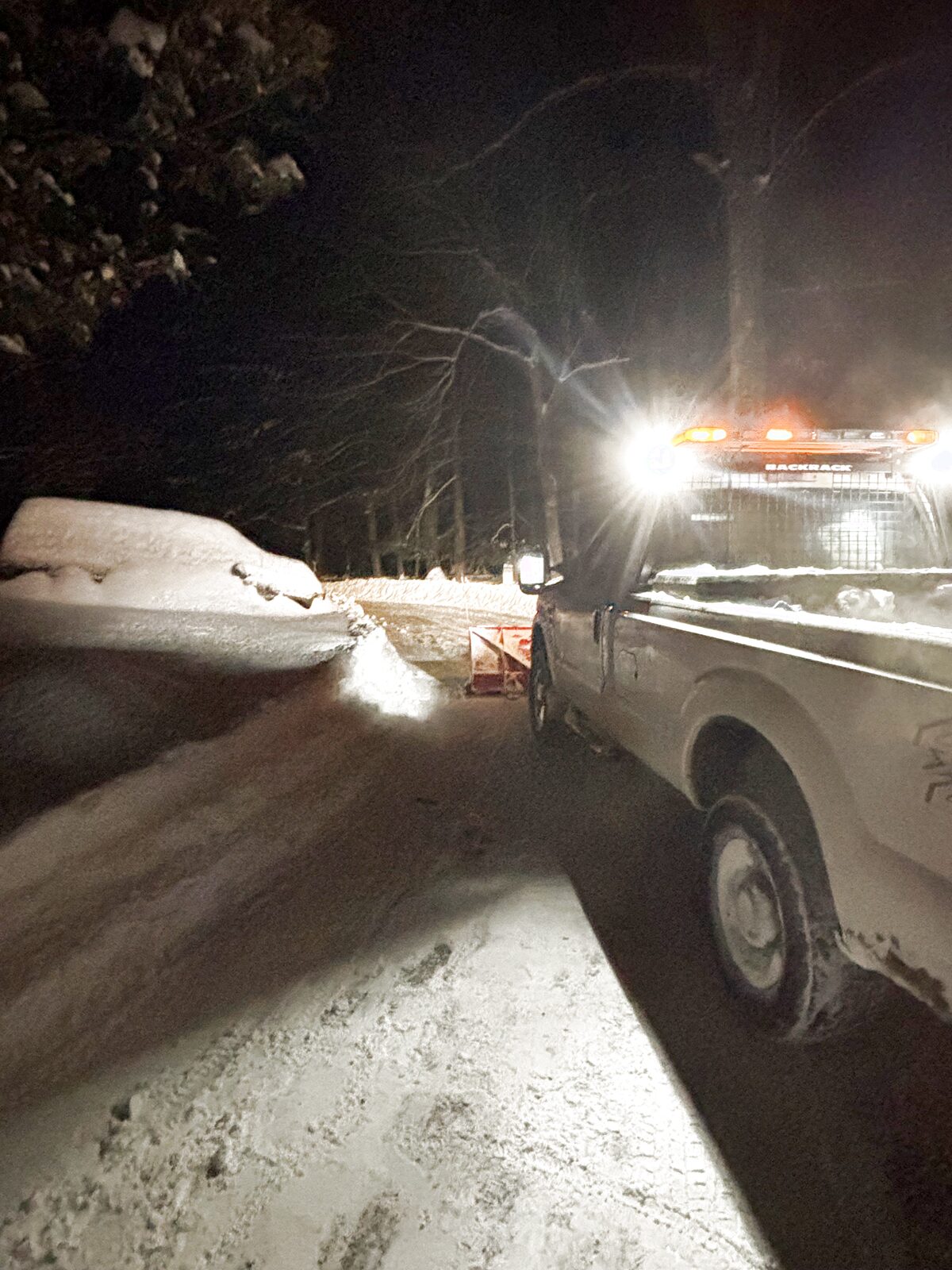 Billz Removal Solutions truck plowing a residential driveway during a Hudson Valley snow storm